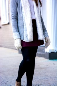 woman wearing gray and white fur coat standing