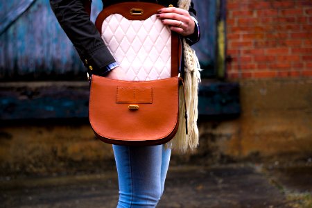 woman wearing red leather crossbody bag photo