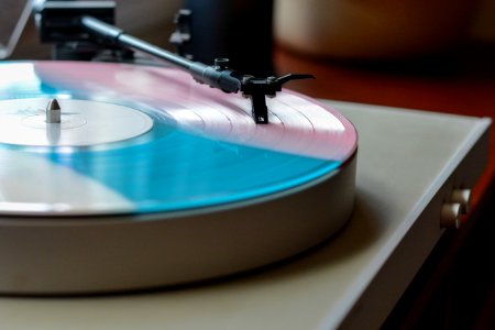 vinyl record on white vinyl player photo