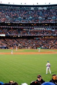 photo of baseball players in stadium during daytime