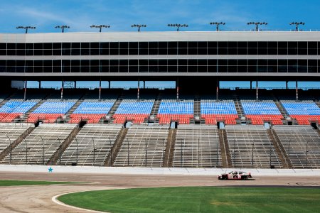 aerial photography of car on stadium under clear blue sky