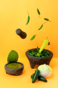 Various vegetables on an orangish yellow surface. photo