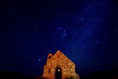 brown brick house under starry night