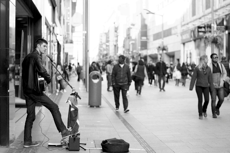 man playing musical instrument at town