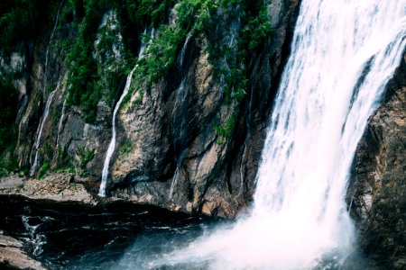 waterfall on rock mountain photo