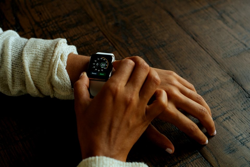 silver aluminum Apple Watch with white Sport Band