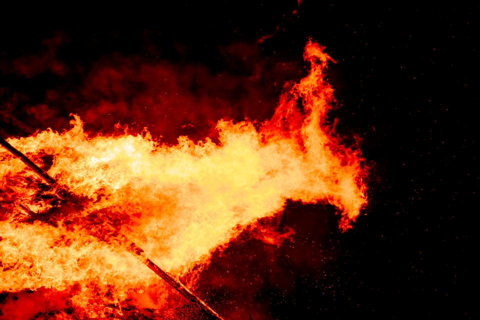 stick exposed in fire at nighttime