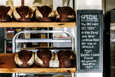breads on brown wooden shelf photo