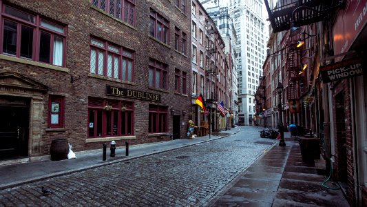 brown concrete building with alley
