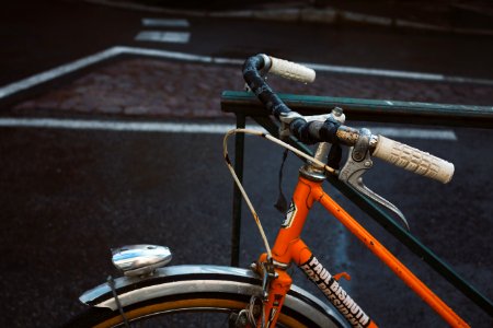 bicycle locked into steel rail photo