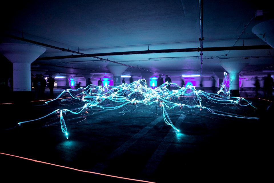 linked neon lights under white painted basement