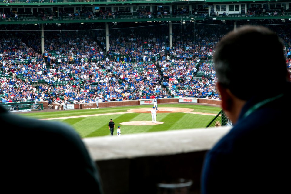 group of people watching baseball game