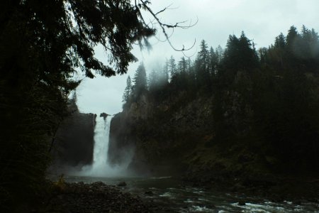 waterfalls with fog landscape during daytime photo