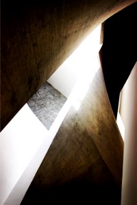 Edges of rocky architectural walls and designs reflecting light and casing shadows photo
