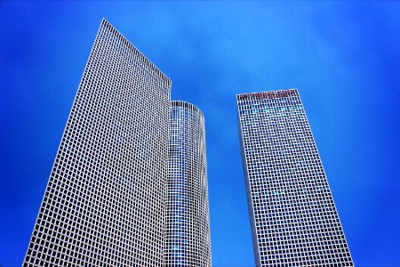low-angle photography of three high-rise buildings photo
