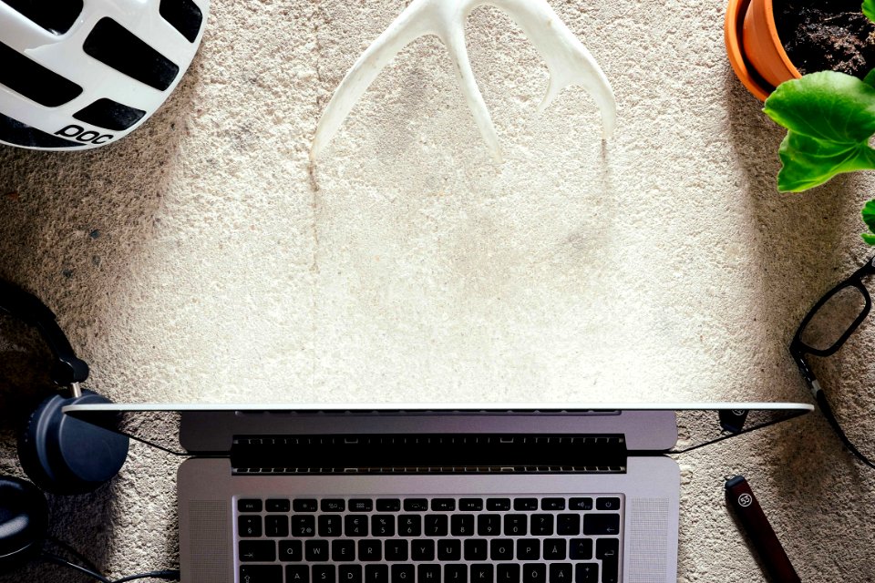 macbook pro on white table