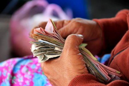 person holding banknotes photo