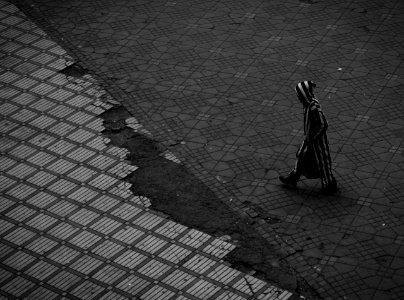 person walking on road