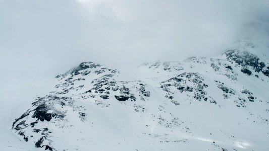 gray rock covered with white snow photo