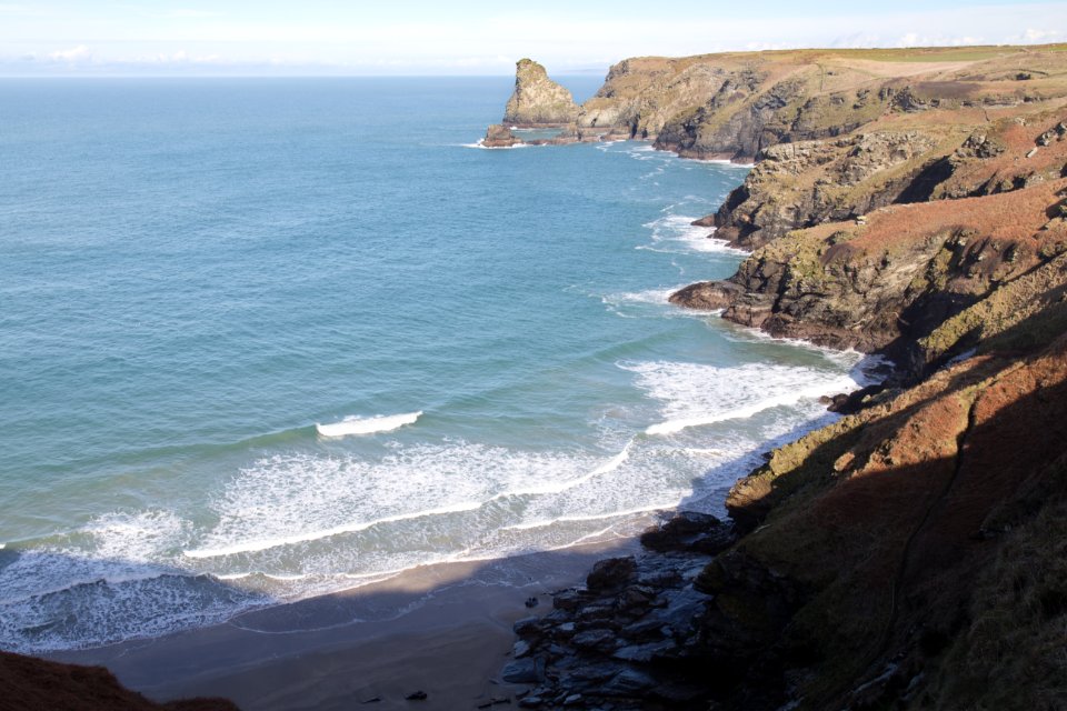 brown seashore rocks during daytime photo