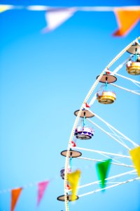 white and yellow Ferris wheel under blue skies photo photo
