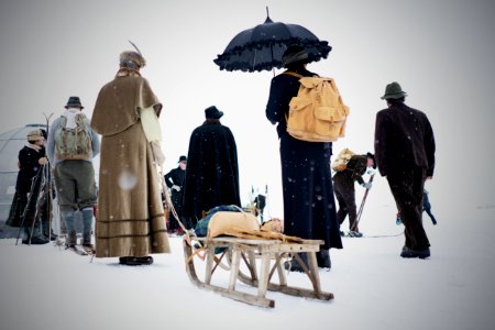 people walking in snowy day photo