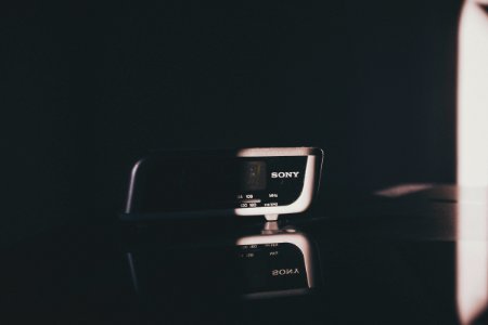Sony digital alarm clock inside dark room photo