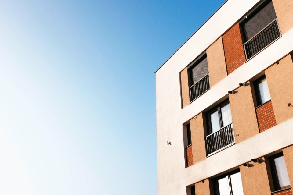 white and brown concrete building under blue sky during daytime photo