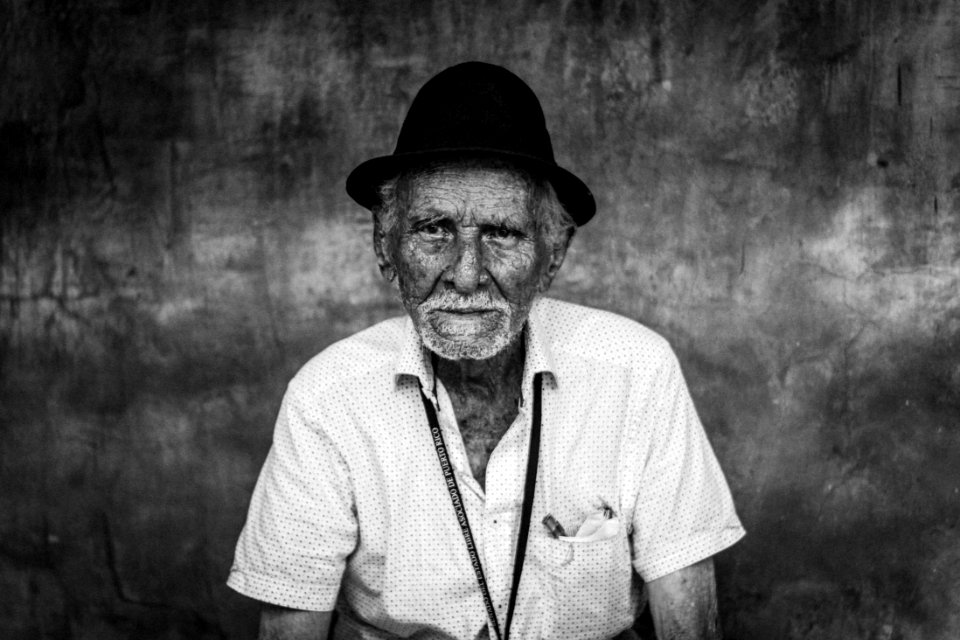 man wearing shirt and hat