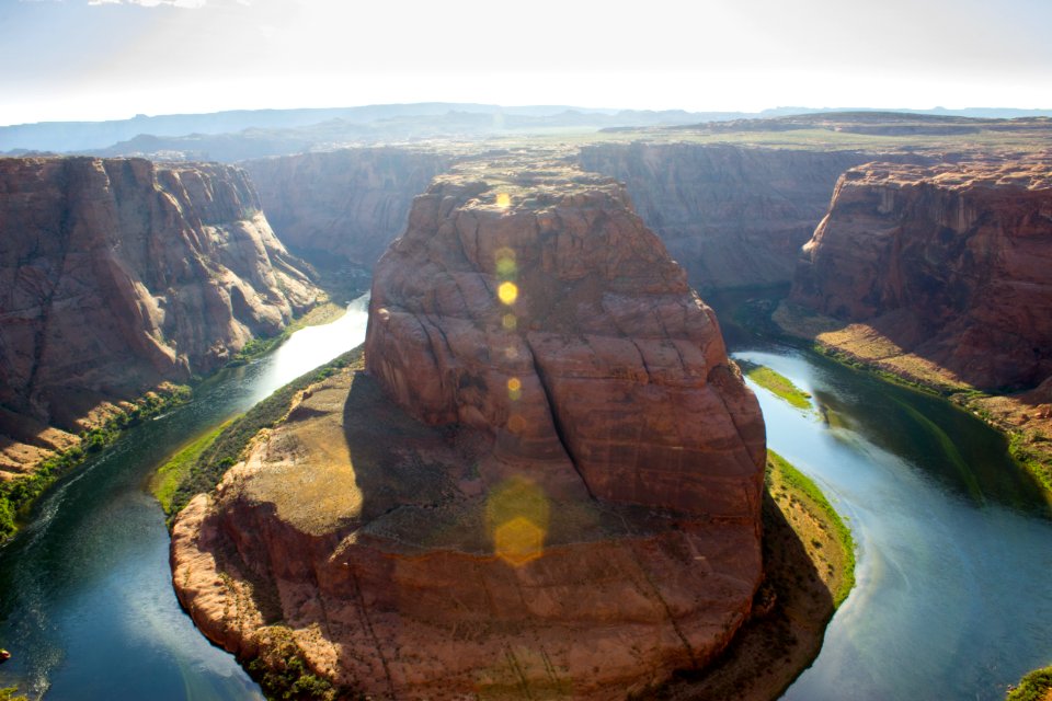 birds eye photography of rock formations and body of water during daytime photo