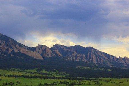 wide field grass distance with mountains during daytime photo