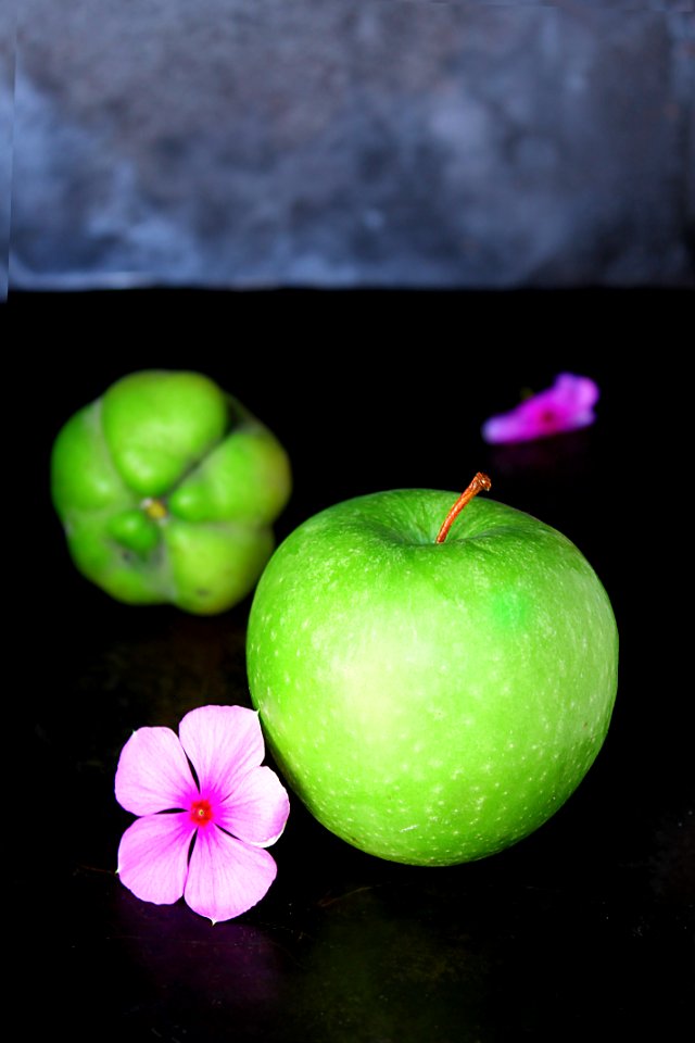 green apple and pink flower