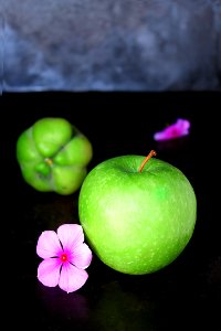 green apple and pink flower