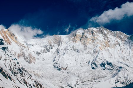 glacier mountain under white and blue sky