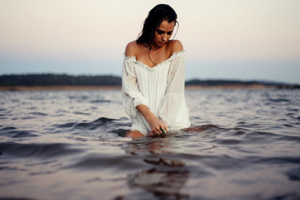 woman posing in body of water photo