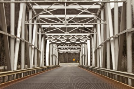 empty metal bridge during daytime
