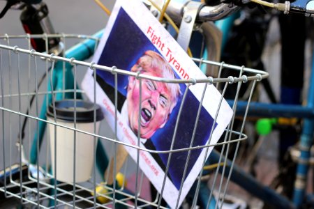 Donald Trump paper inside bicycle basket photo