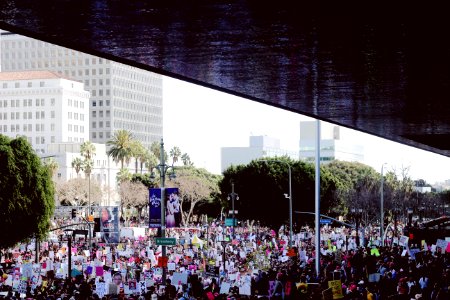 crowd of people near concrete buildings during daytime photo
