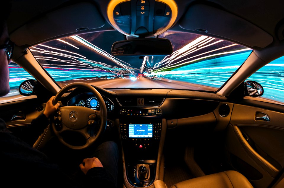 time lapse photography of man riding car