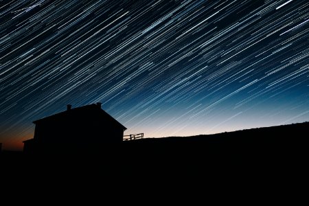 time-lapse photography of house silhouette at night photo