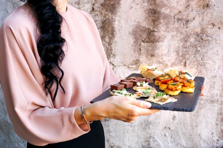 person holding tray with foods photo