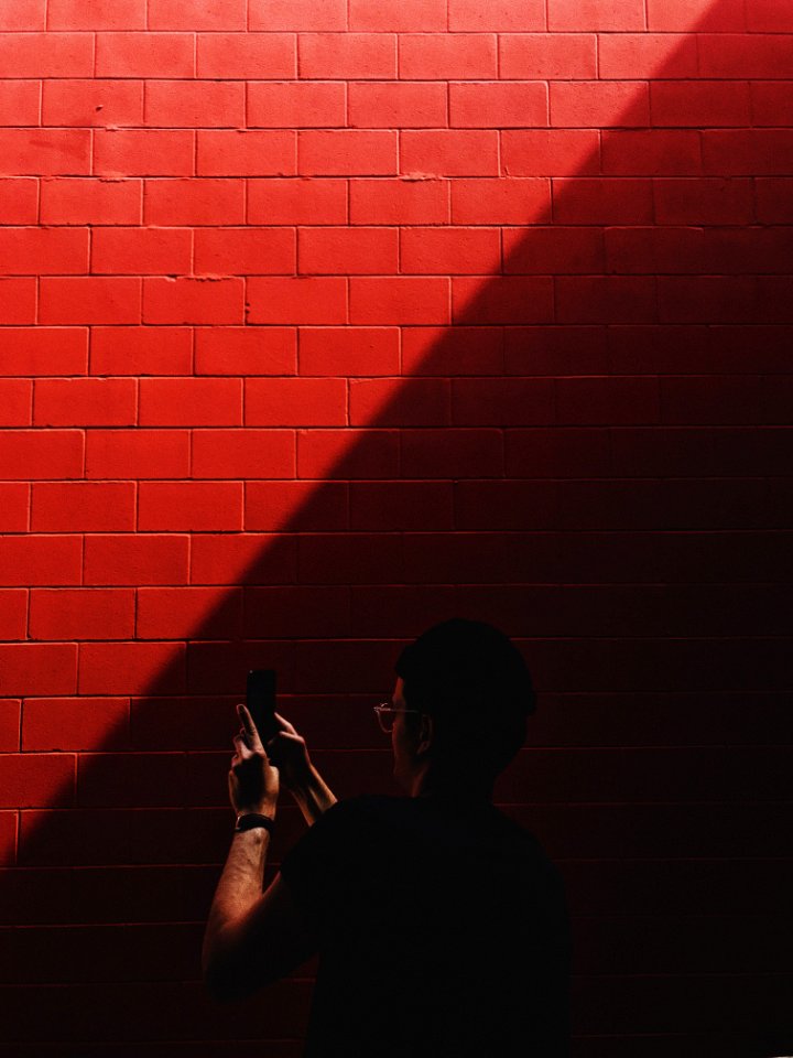 person capturing red brick