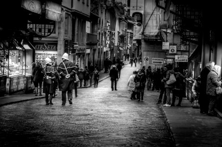 people walking along road photo