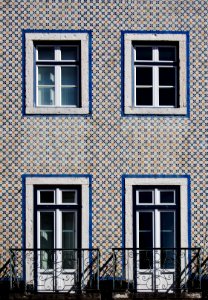 white wooden framed windows on concrete building
