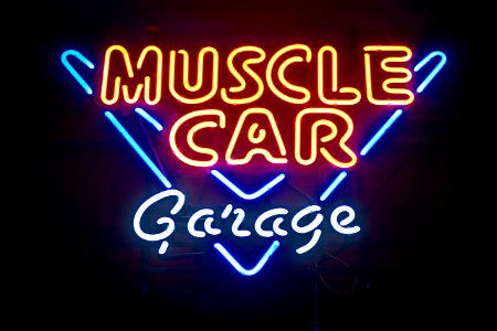 turned on Muscle Car Garage neon light signage photo