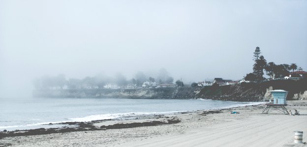 sea shore and sea waves near town photo