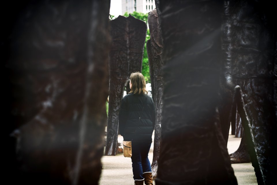 woman standing beside monument