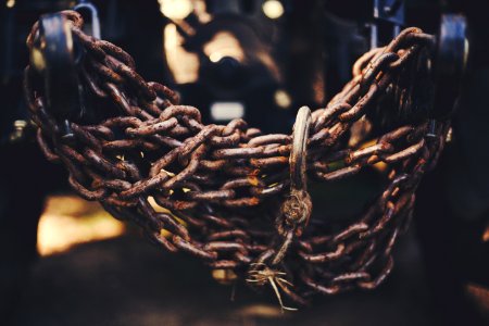 close up photo of brown metal chain photo
