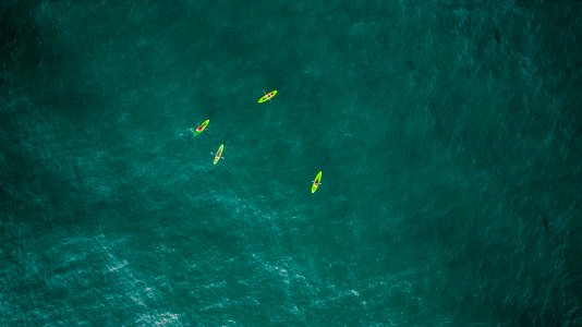 aerial photography of four green kayaks