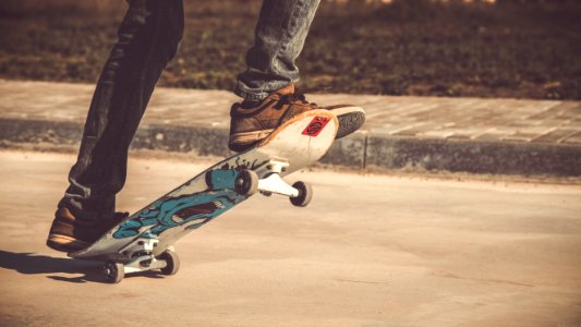 person riding skateboard during daytime photo